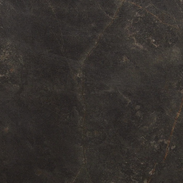 Tekstura ciemnego materiału z subtelnymi przebarwieniami i rysami